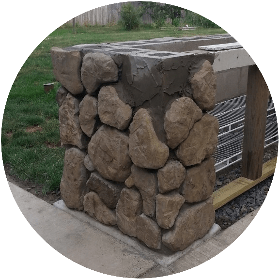 Placing fieldstone on a grill island