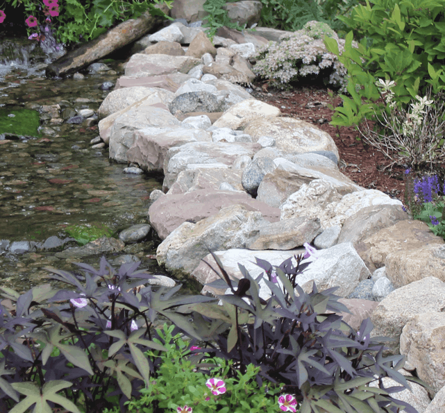 Using large character boulders to make a man made stream look natural