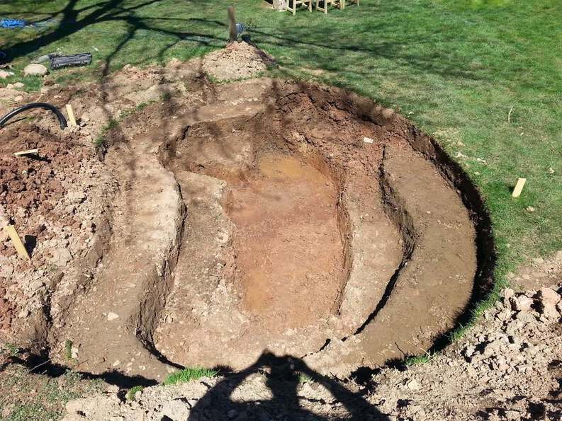 digging a backyard pond with three levels