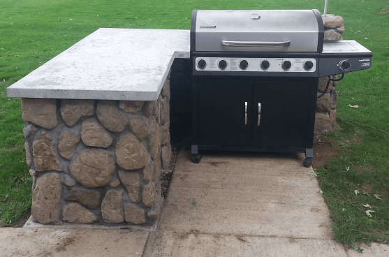 cinder block grill island with concrete countertop