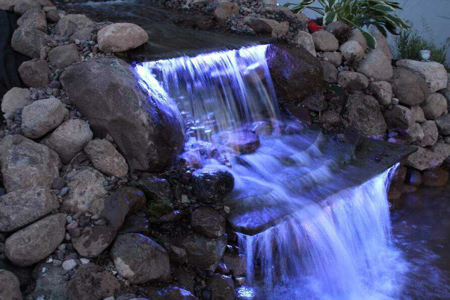 color changing backyard waterfall pond