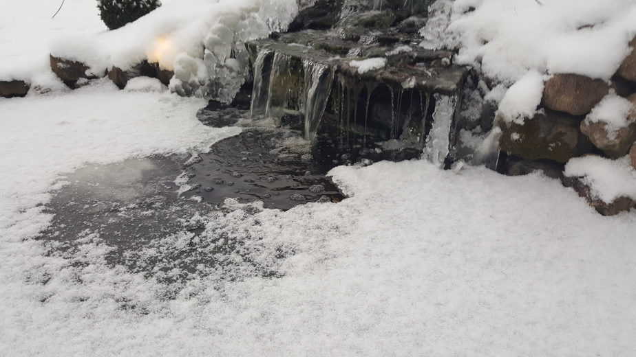 waterfall and pond water feature in the winter