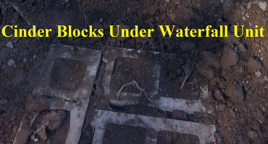 Cinder blocks under waterfall unit