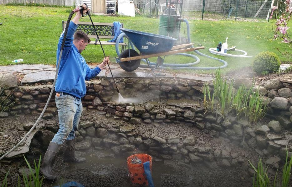 Pressure wash spring pond cleaning